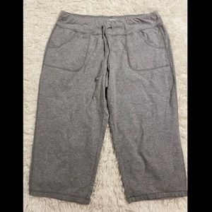 Grey capris, athletic wear.